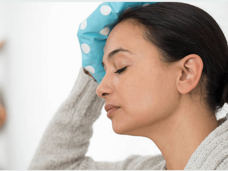 Woman holding ice pack