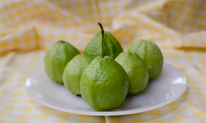 Green guava on a plate